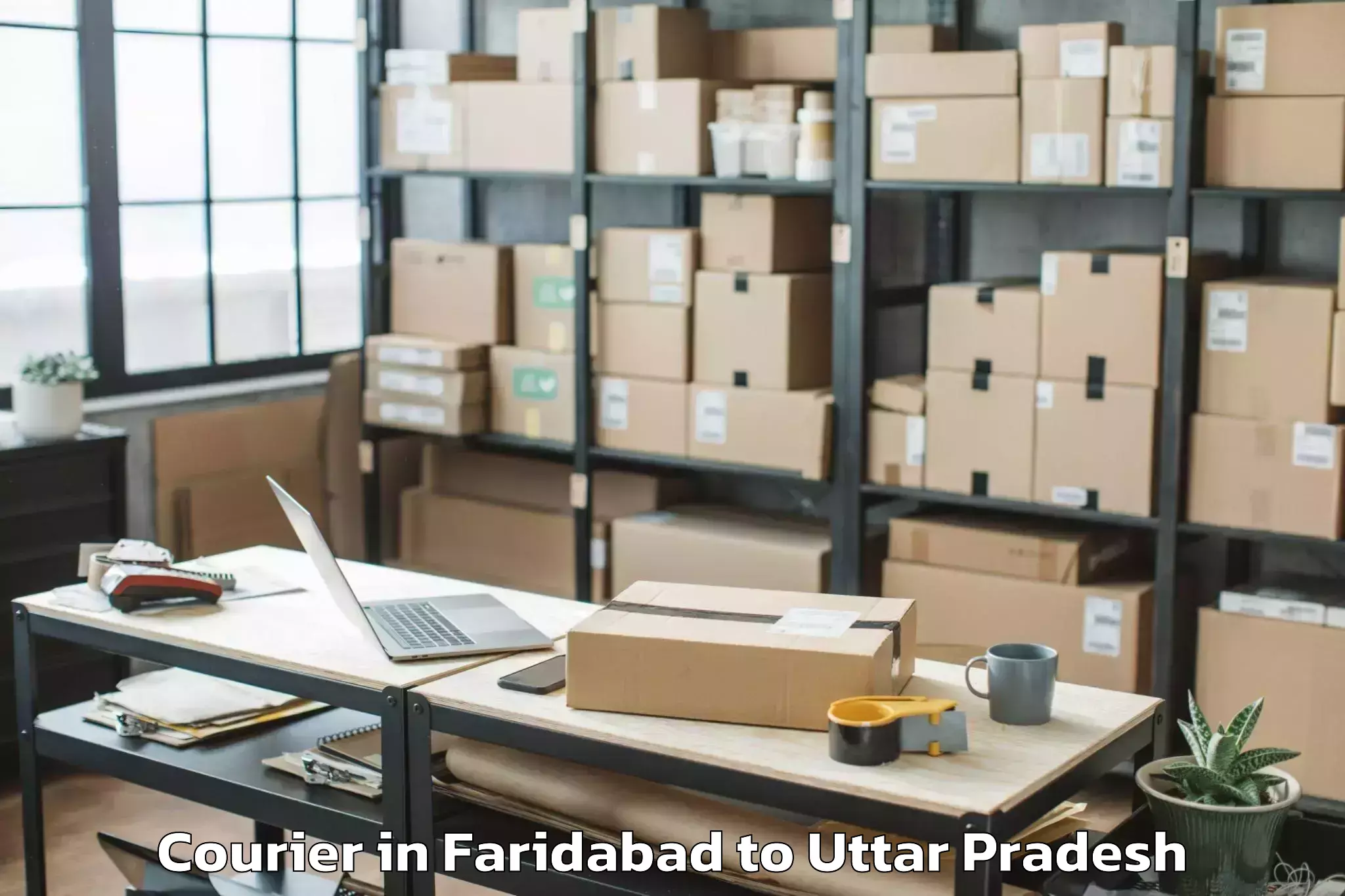 Top Faridabad to Khadda Courier Available